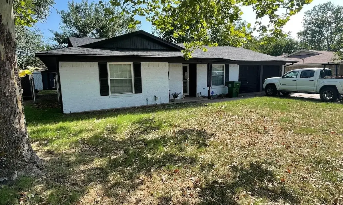 Professional roofing crew working on a residential roof in Brigham City